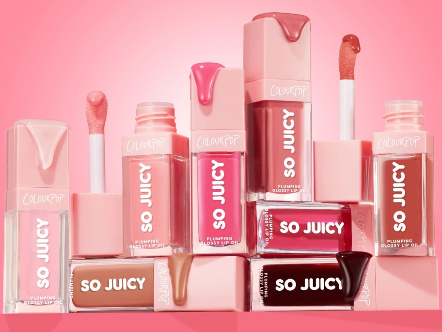 several tubes of ColourPop So Juicy Plumping Glossy Lip Oil some open, some closed