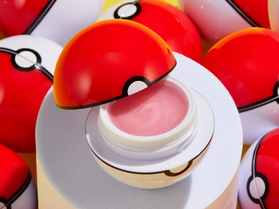 ColourPop You're a Catch Pokemon Lip Mask in a Poke ball shaped container with more behind it 