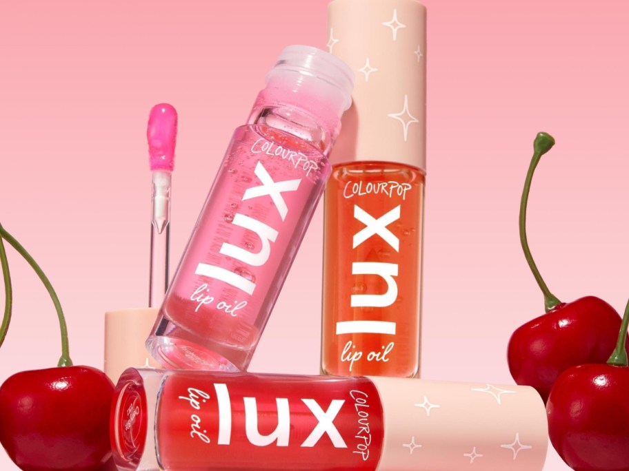 3 tubes of ColourPop Luxe Liquid Lip in various colors, cherries around them