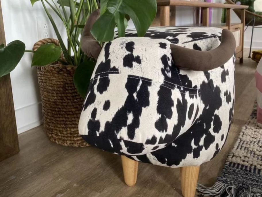 Brown and white cow print on a steer themed ottoman
