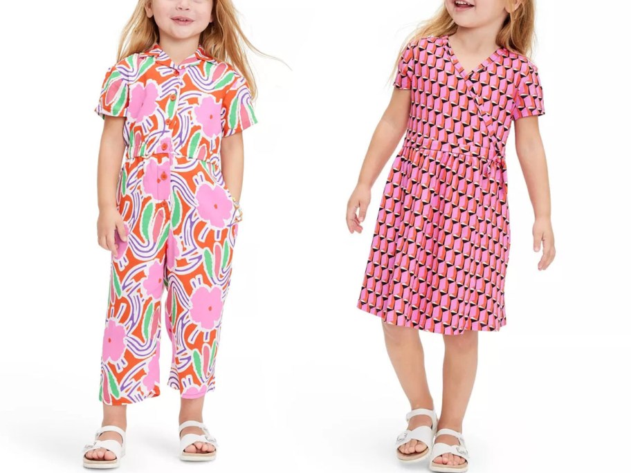 two toddler girls wearing pink dress and jumpsuit