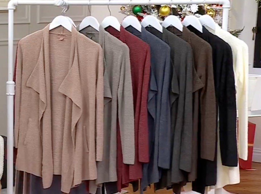 dipslay of barefoot cardigan on a clothing rack