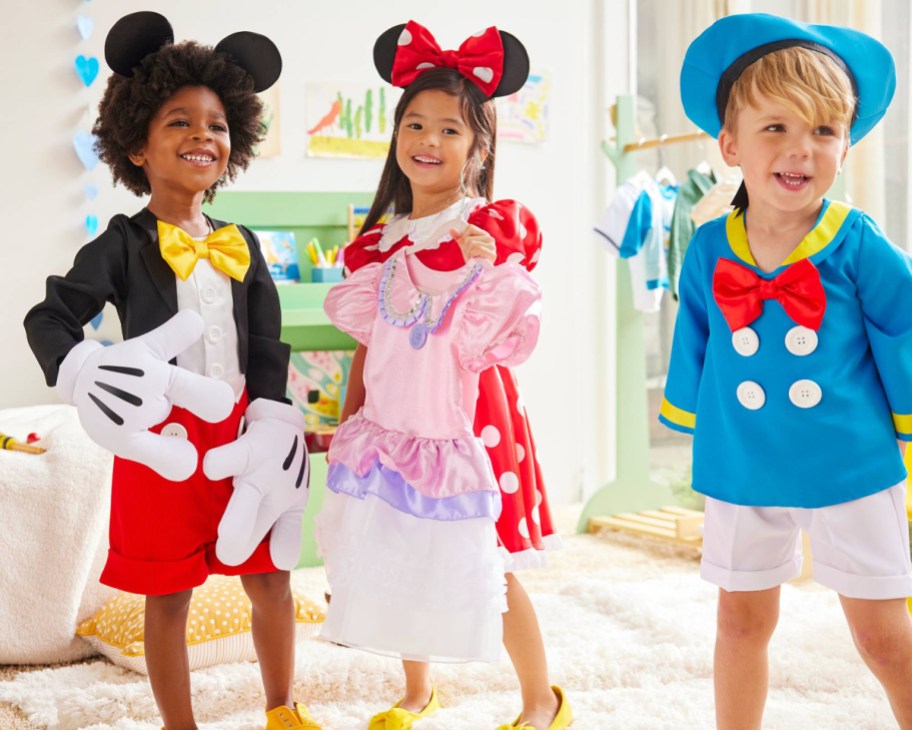 kids dressed up as mickey minnie and donald