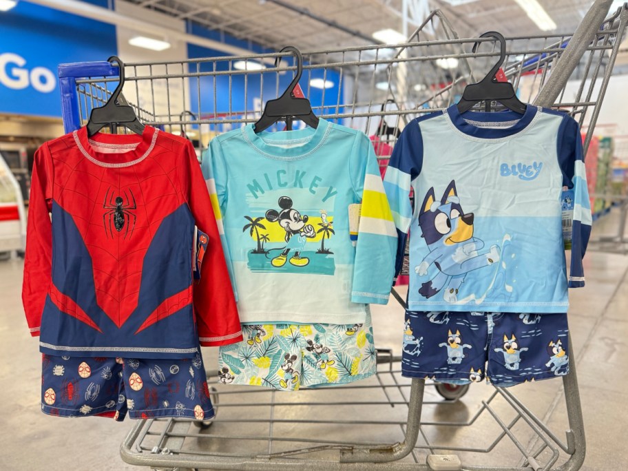 display of boyl Disney and bluey bath suit sets hung on Sams club cart