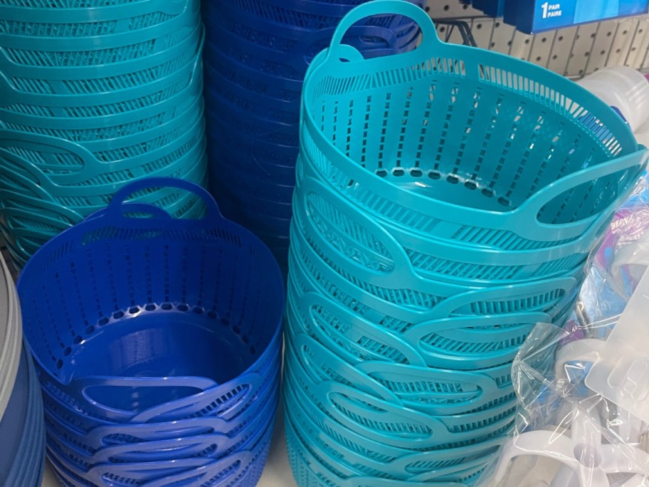 light blue and dark blue round slotted plastic storage baskets with handles