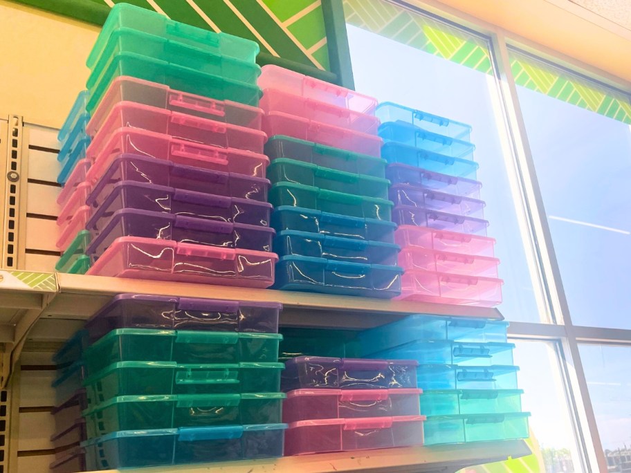 stacks of colorful plastic organizer boxes with locking lids