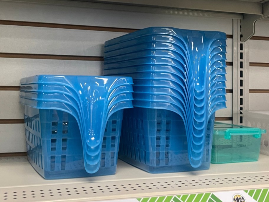 blue slotted plastic baskets with handles on a shelf