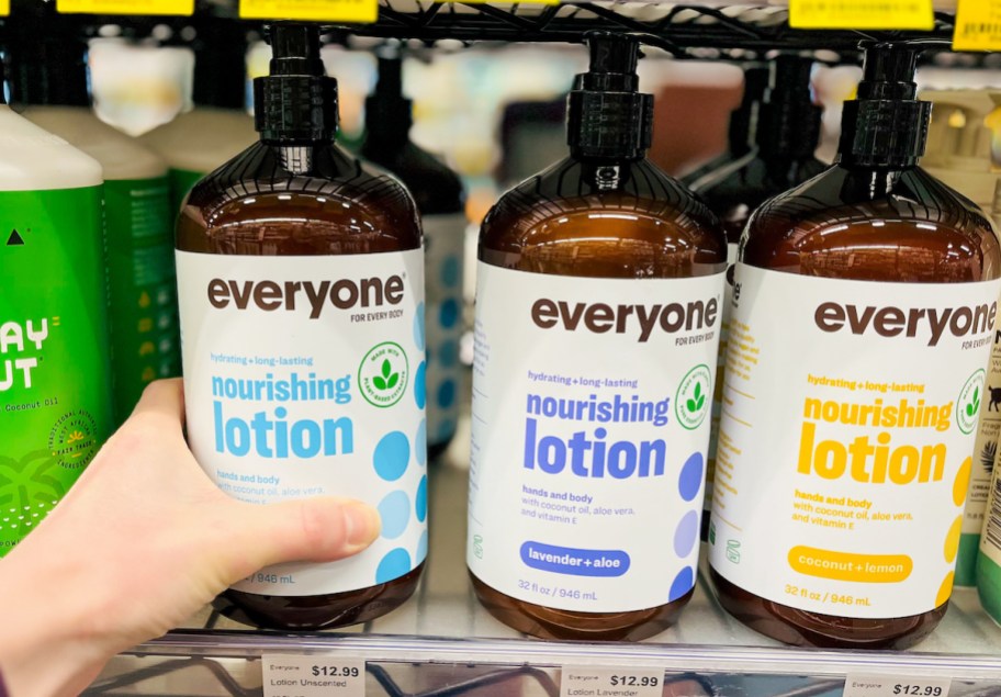 hand holding bottle of everyone unscented lotion on store shelf