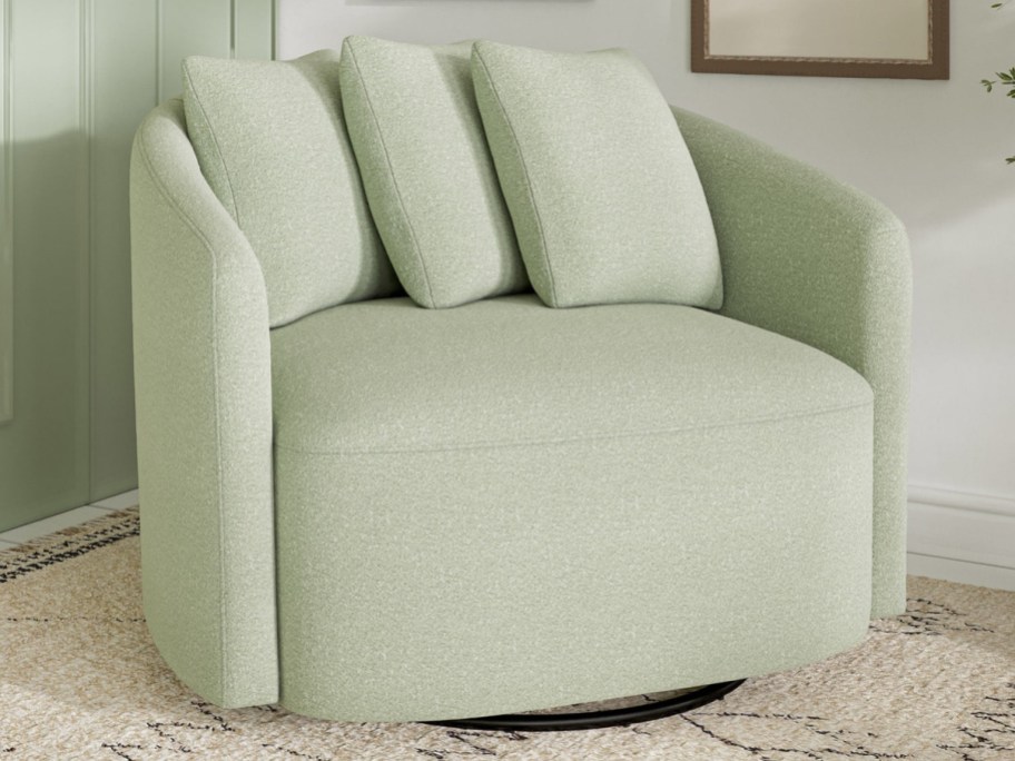 green swivel chair displayed on a carpet in the living room