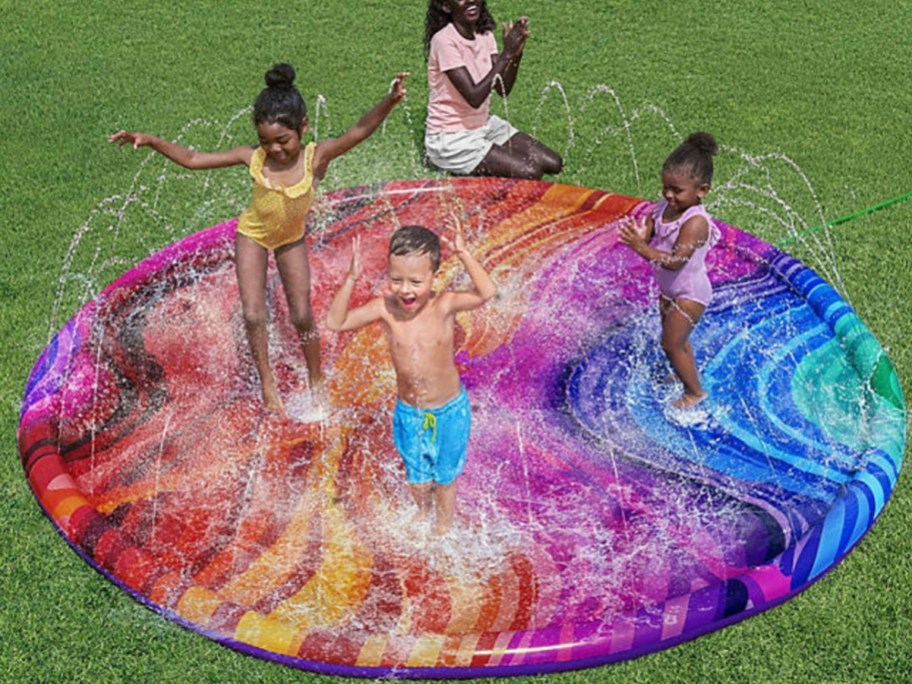 colorful splash pad with kids playing on it