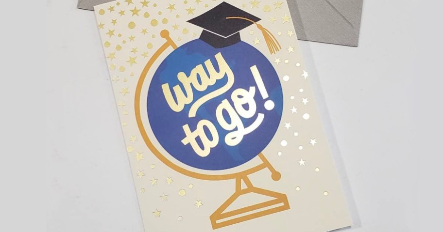 way to go graduation card sitting on table with envelope