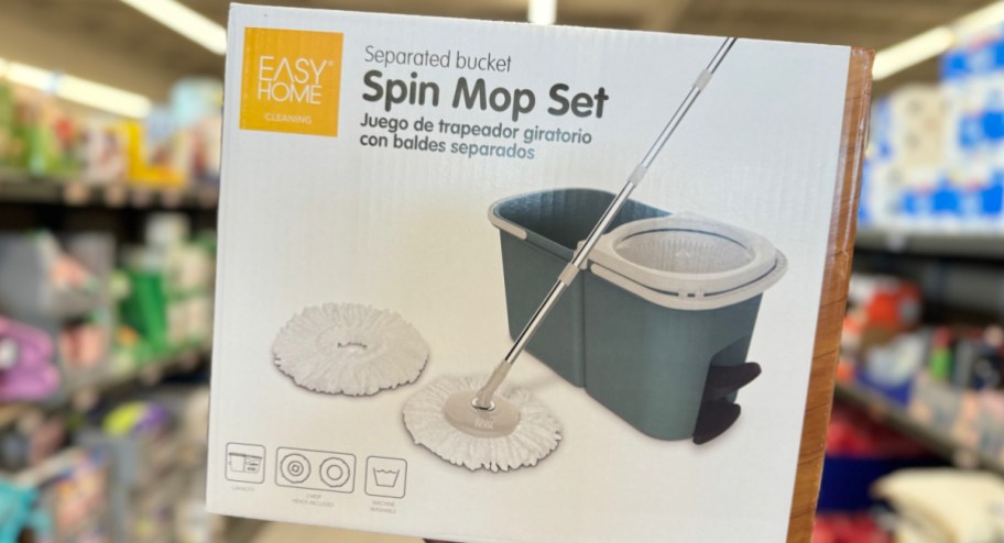 hand holding ALDI spin mop set at the store