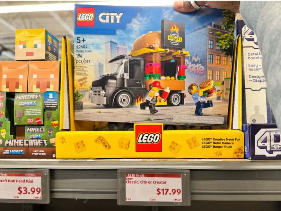 hand holding LEGO city with price tag show below