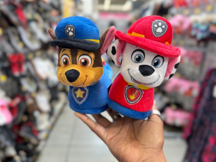 hand holding Nickelodeon Paw Patrol Marshall and Chase Boys Dual Sizes Slippers at the store