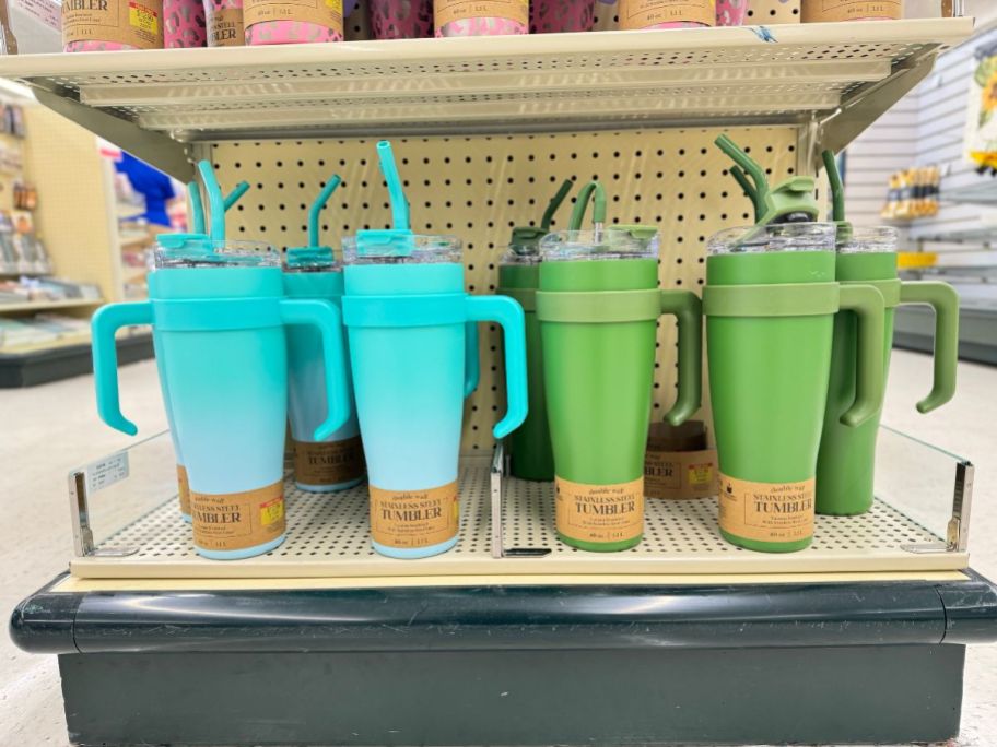 teal blue and bright green 40 oz stainless steel straw tumblers at Hobby Lobby