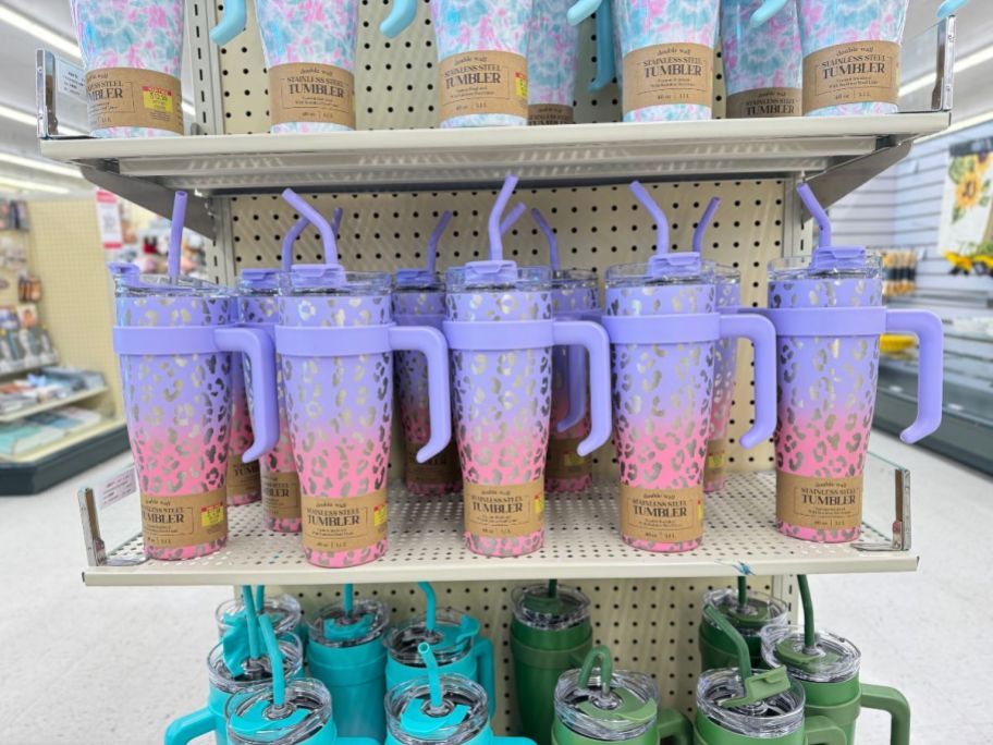 purple, pink and gold ombre leopard print 40 oz stainless steel straw tumblers on shelf at Hobby Lobby