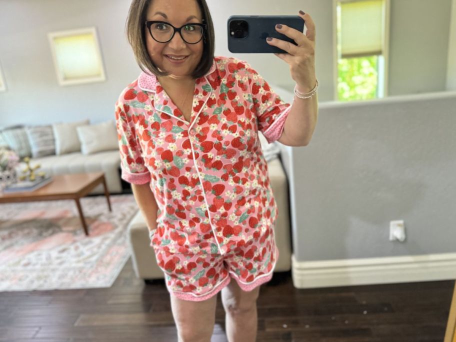 woman taking a selfie in a pair of strawberry print shots pajamas