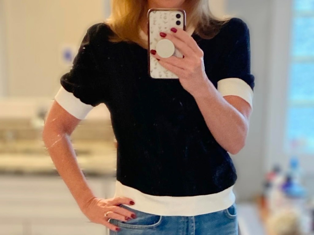 woman wearing black and white puff sleeve top
