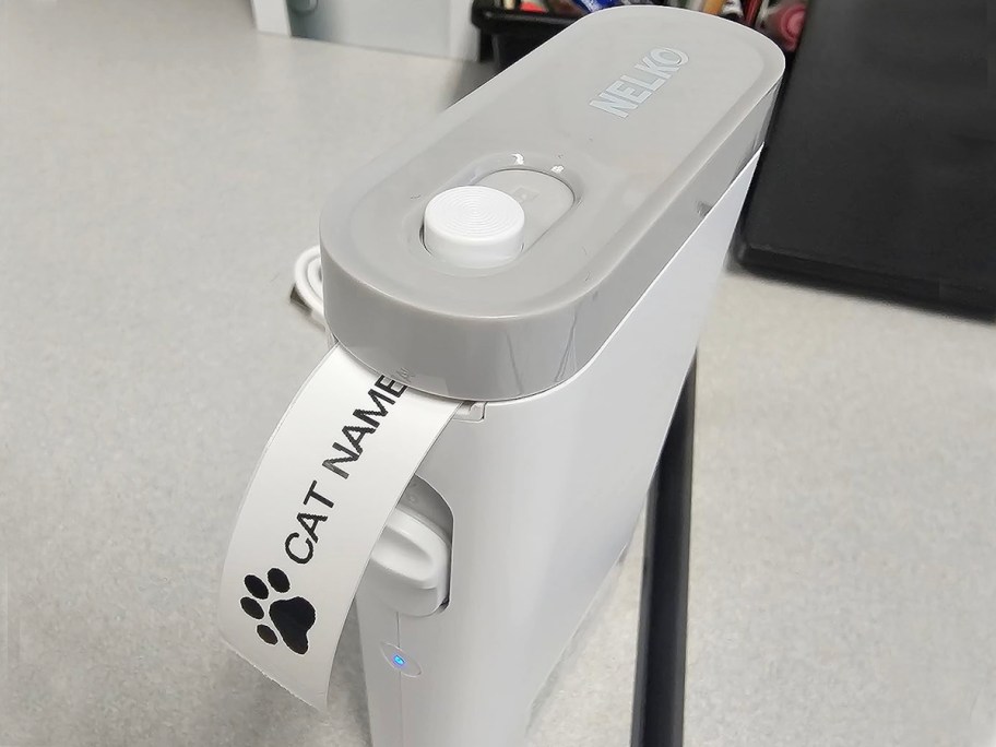 nelko white label maker with cat name label coming out of it