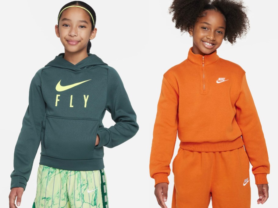 two girls wearing green and orange Nike hoodies