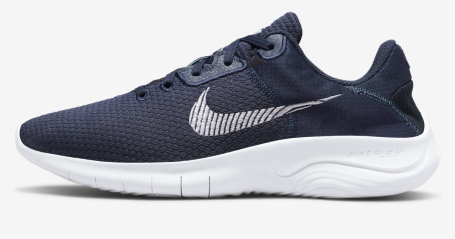navy blue and white men's Nike running shoe