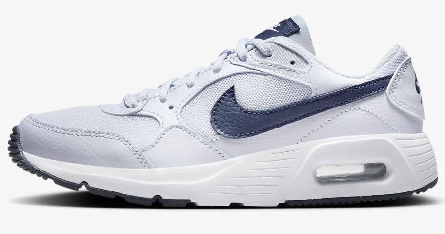 white Nike Air Max SC kid's shoe with blue accents