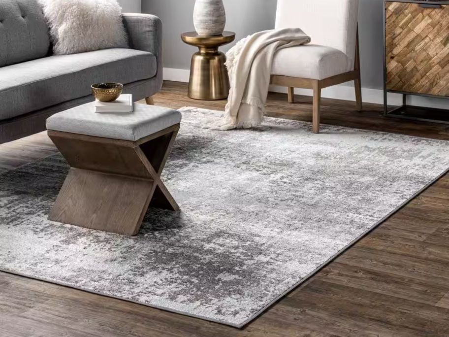 nuLOOM Jade Faded Abstract Light Grey 6'7" x 9' Area Rug in living room