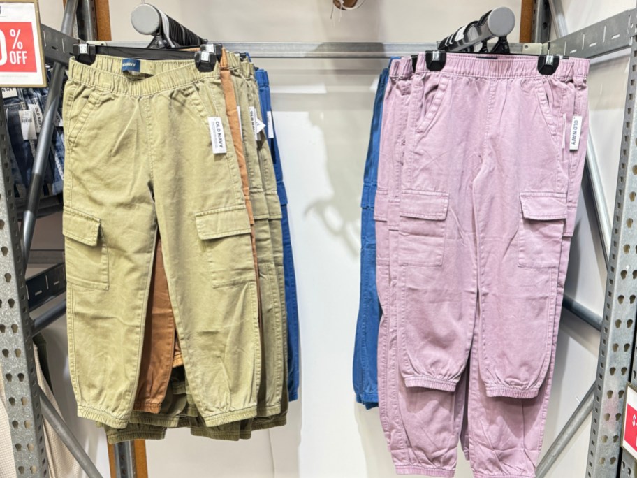 pink and tan girls cargo pants on hangers
