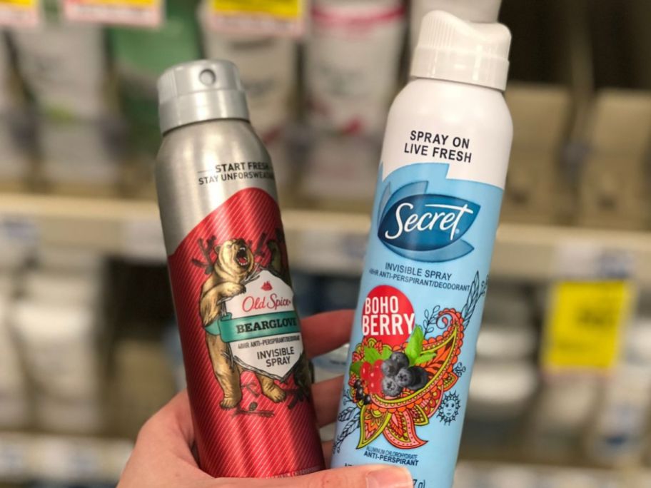 old spice and secret spray being held up in store