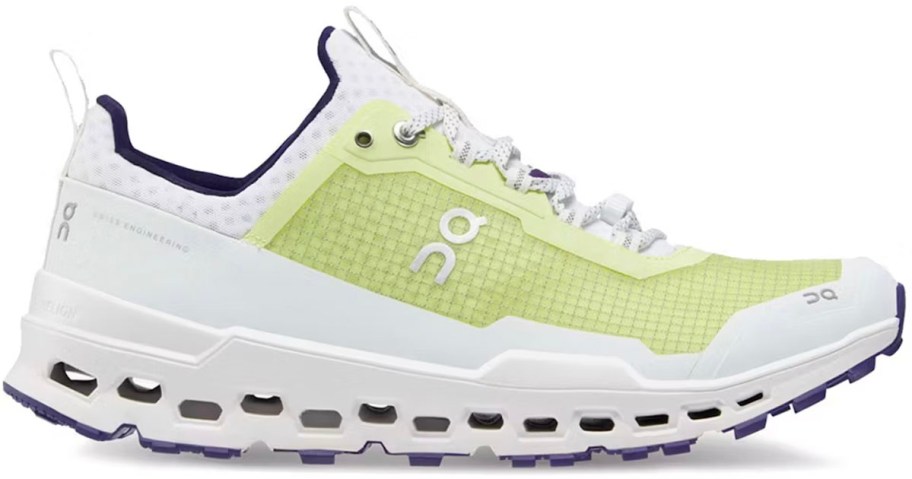 stock image of white and yellow on cloud shoe