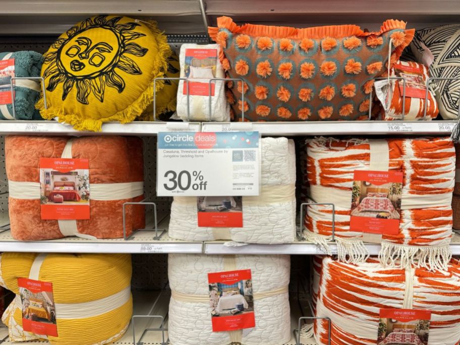 opalhouse bedding collection in shades of orange and yellow on a store shelf