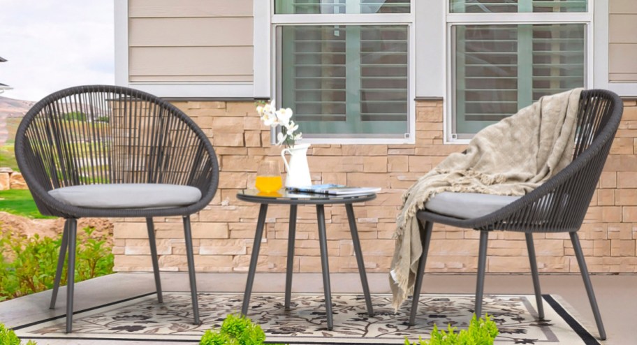 outoutdoor seating with cushions and a center table outside on the patio