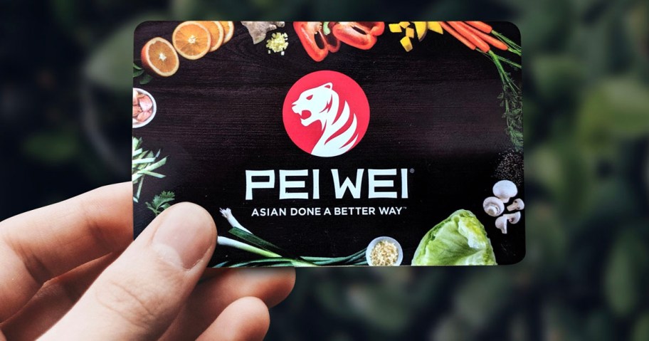 hand holding pei wei gift card