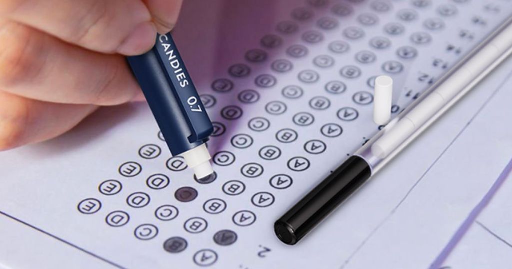 a hand holding a pencil filling in a bubble on an answer sheet