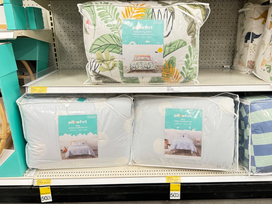 pillowfort comforter sets on shelf in target store