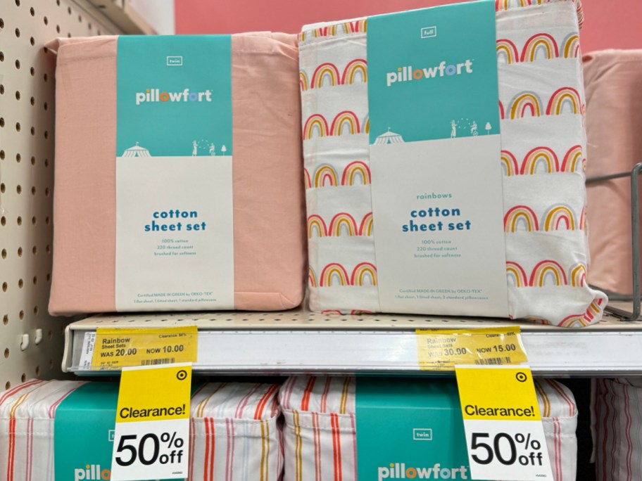 pink and white rainbow pillowfort sheet sets on shelf in target store