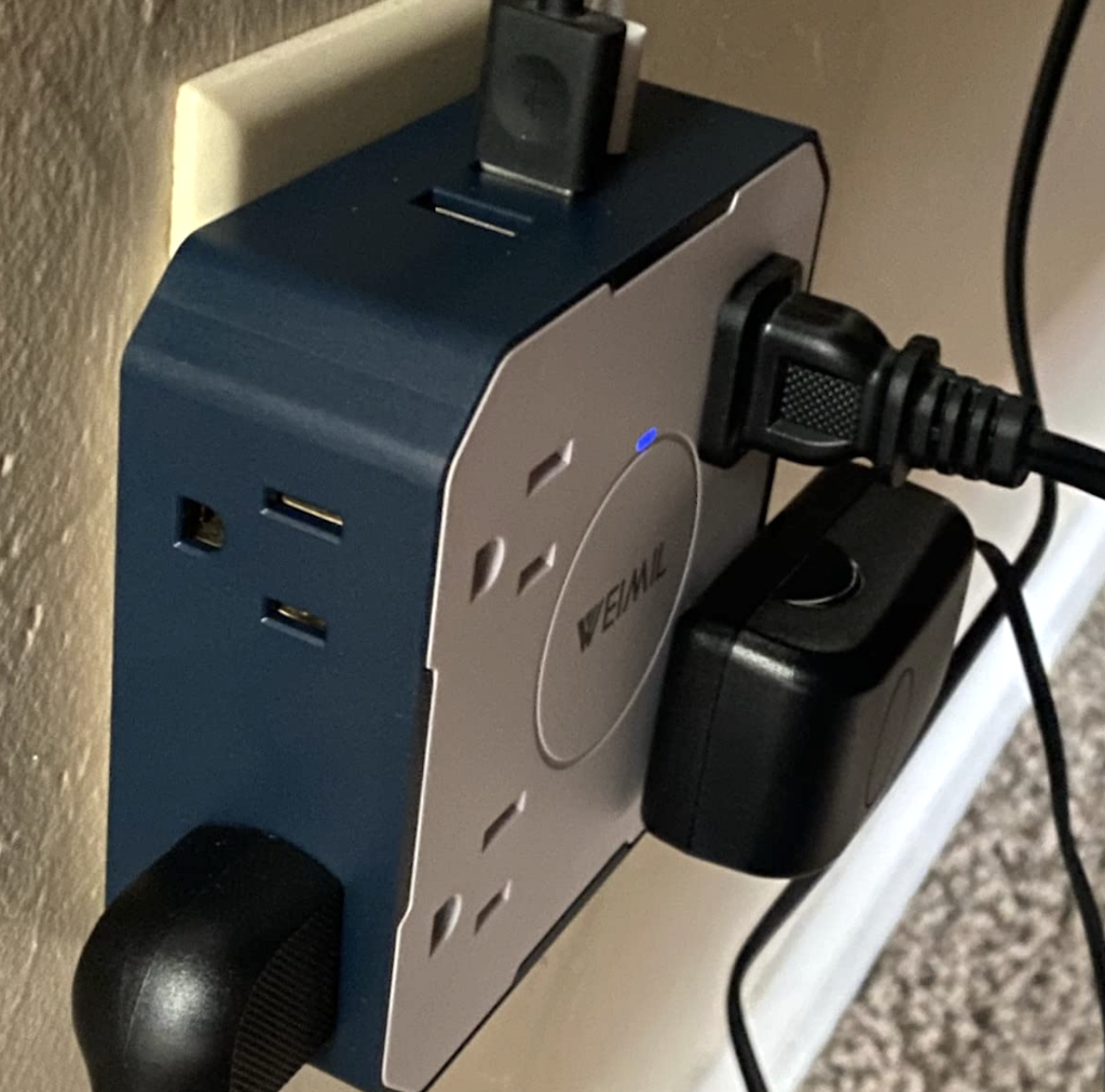 close up of plugin wall outlet extender 