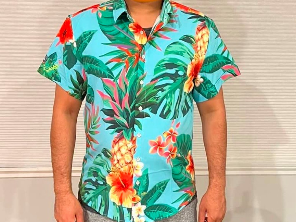 man wearing blue pineapple hawaiin shirt
