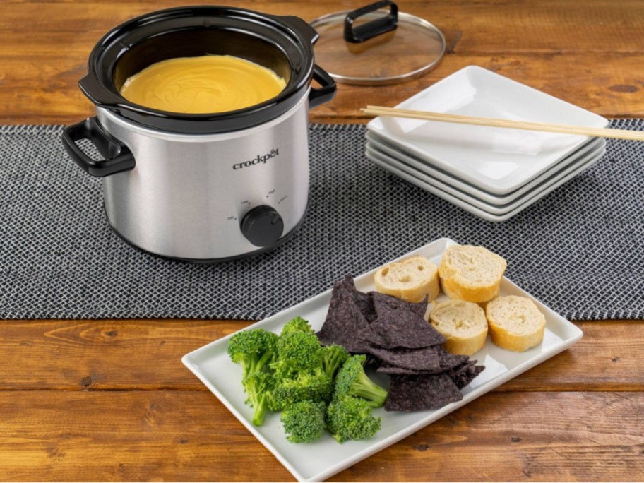 small crock pot with cheese and veggies to dip