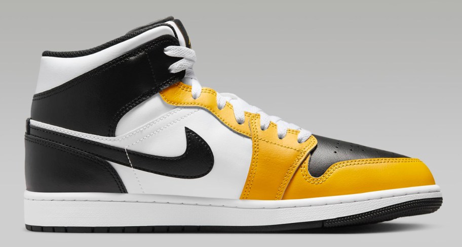 stock image of Air Jordan 1 Men's Shoes in yellow and black