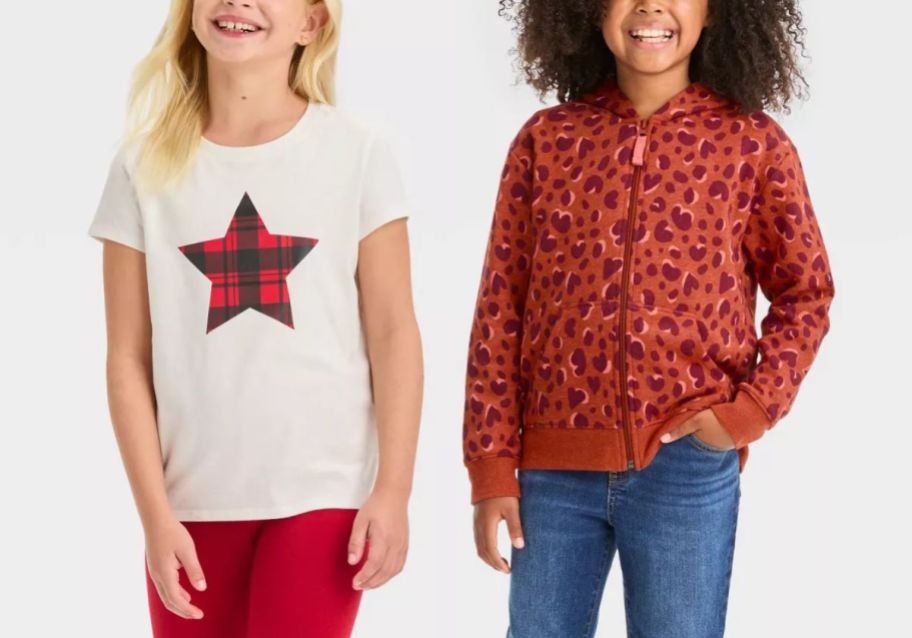 two girls wearing clearance tops form target