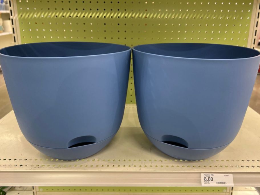 two 12 inch self watering planters on store self