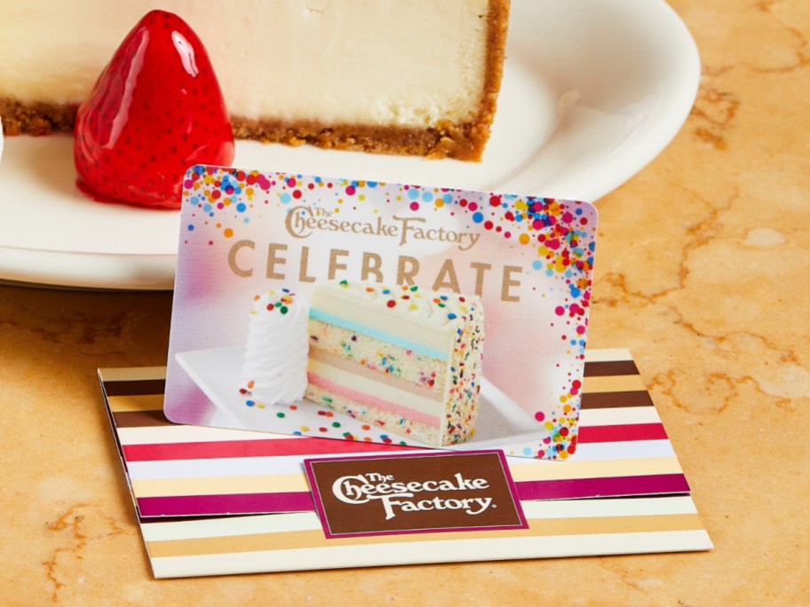 gift card next to a slice of cheesecake