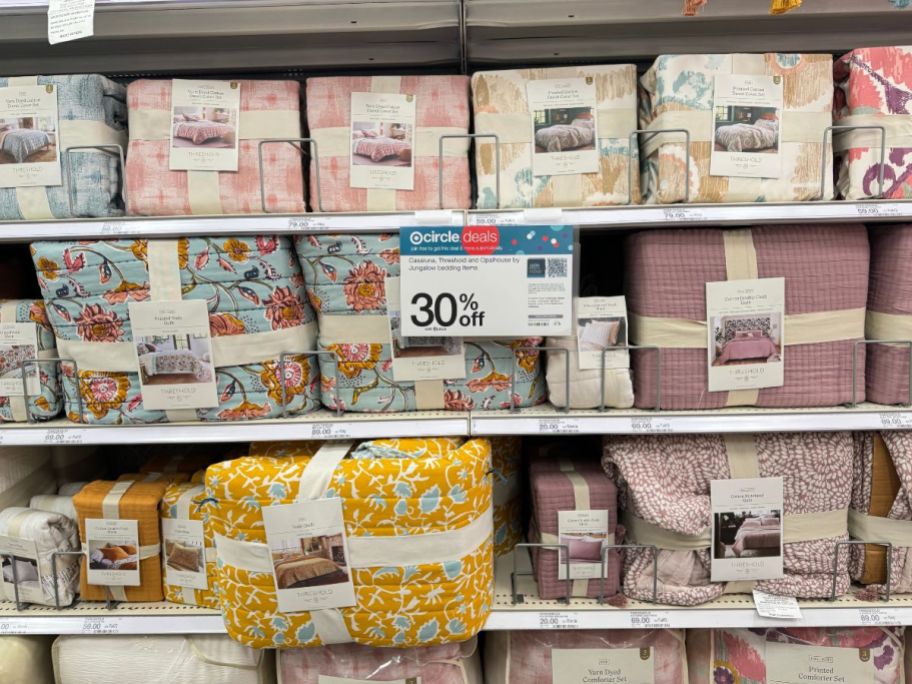 threshold bedding collection sheets and quilts on a store shelf