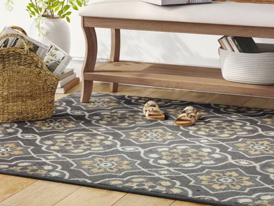 blue floral medallion rug with wood coffee table on top 