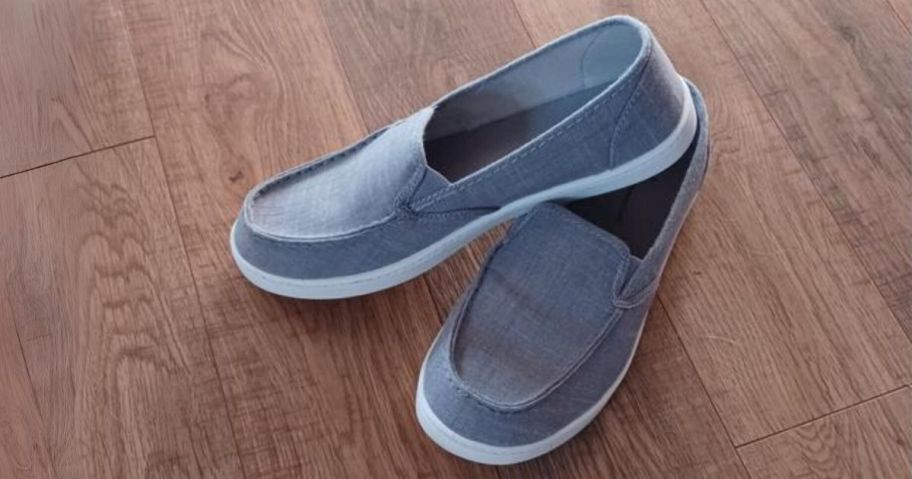 a pair of gray canvas slip on shoes