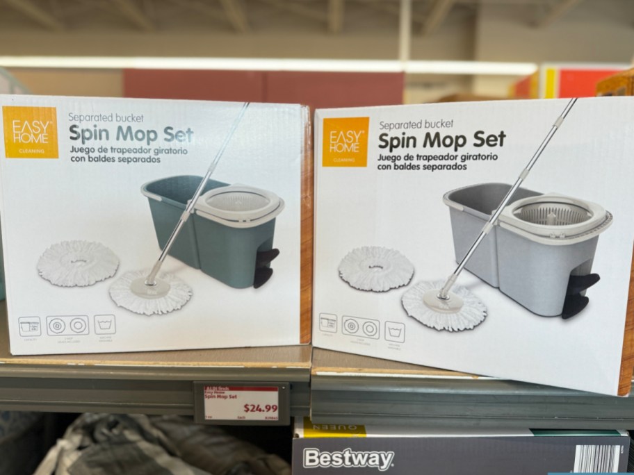 two spin mop sets in dark and light gray displayed at the store