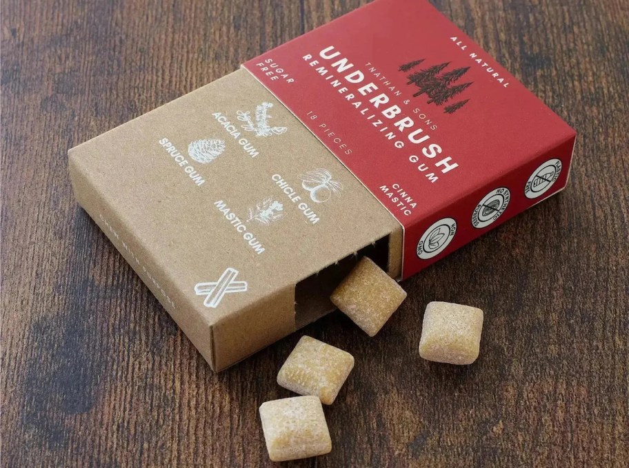 underbrush gum spilling out from box onto wood table