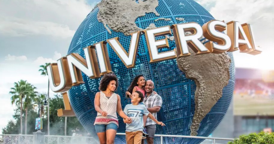 family walking in front of universal studios globe