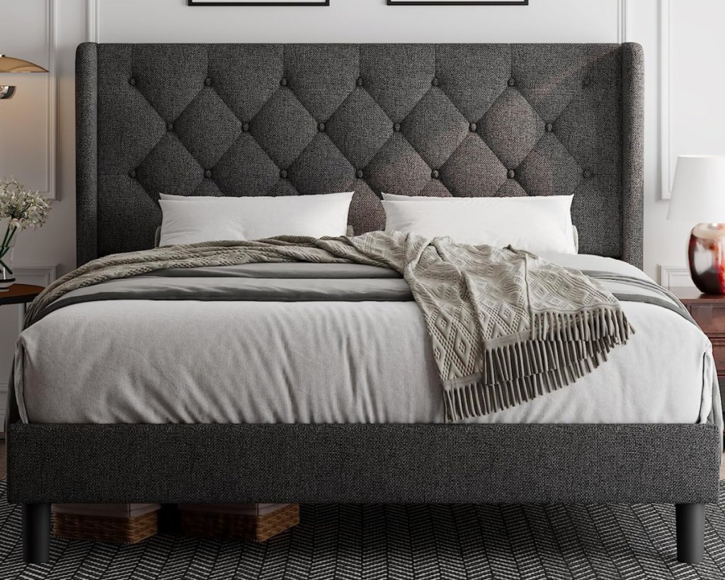dark grey upholsted queen bed